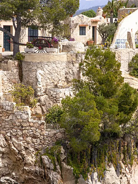 424060 - Mediterranean garden with terraced stone walls and white houses, Mallorca, Spain