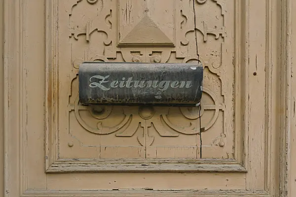 559065 - Old carved front door with letterbox for newspapers, Görlitz, Germany