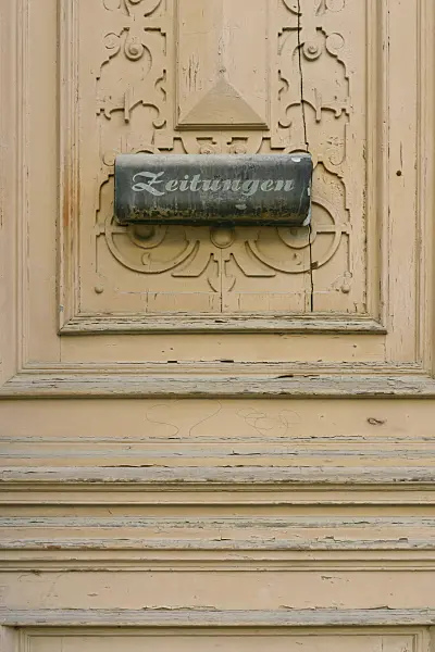 559066 - Old carved front door with letterbox for newspapers, Görlitz, Germany
