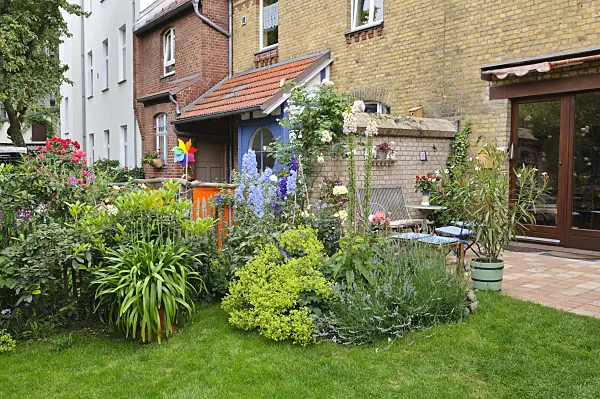473263 - Perennial border and terrace in a backyard garden
