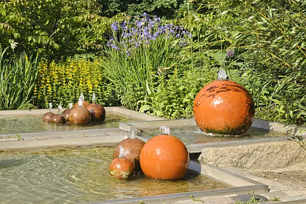 472376 - Perennial garden with fountain