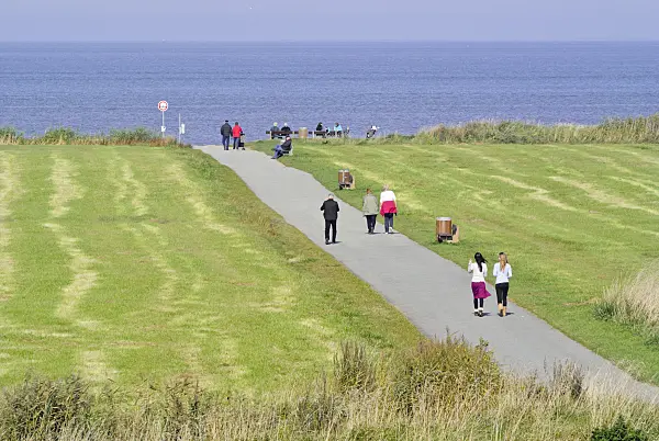 525090 - Promenaders at Elbe River Mouth near Otterndorf, Germany