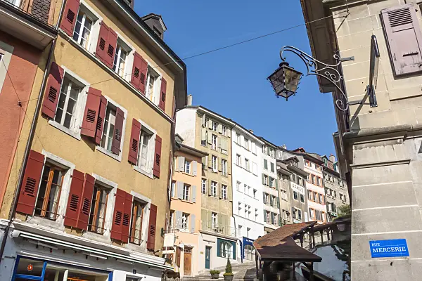 453156 - Red and beige shutters on old houses on an ascending street in the Old Town, Lausanne, Switzerland