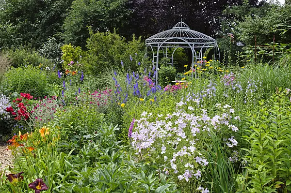 474086 - Rich flowering garden with pavilion