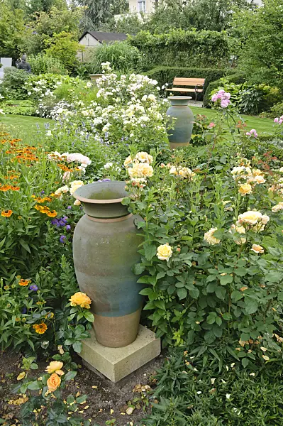 474067 - Rose garden with ceramic vases