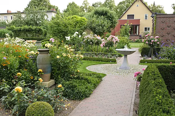 474076 - Rose garden with granite fountain and ceramic vase
