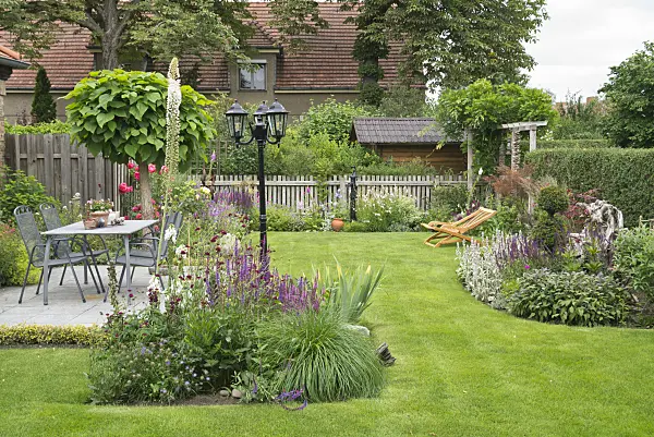 610021 - Seating area and deck chair in a perennial garden