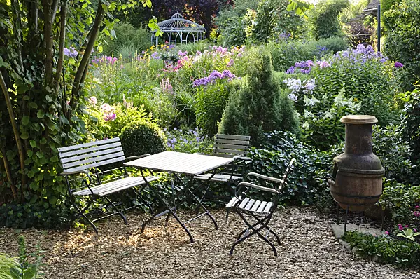 474454 - Seating area with oven in a perennial garden