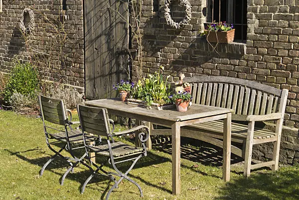 554072 - Seating area with spring decoration in front of a barn