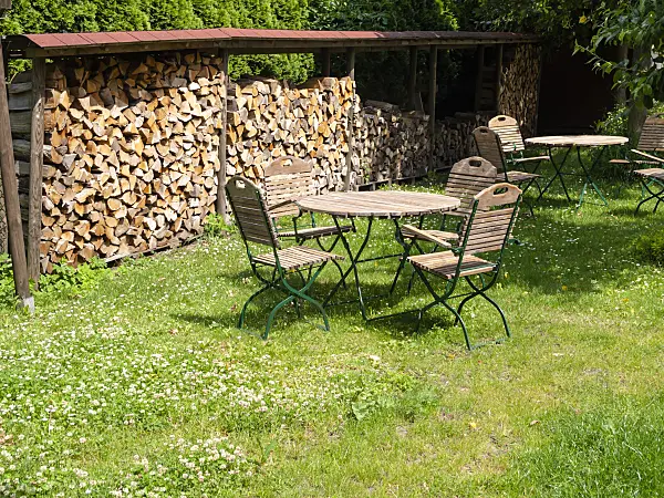 523251 - Stack of wood near a seating area