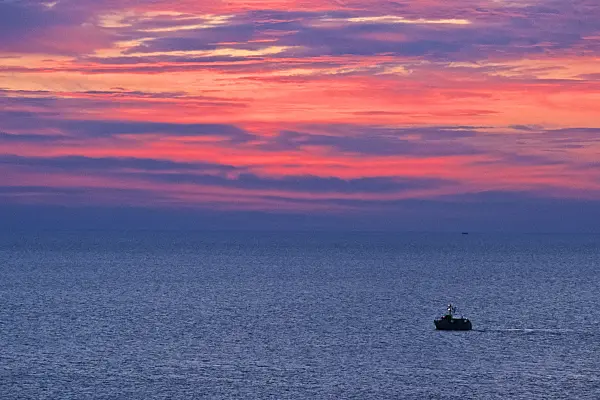 382030 - Sunset with a trawler on the Baltic Sea, Germany