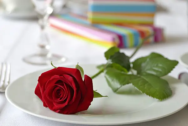 452163 - Table decoration with red rose and presents