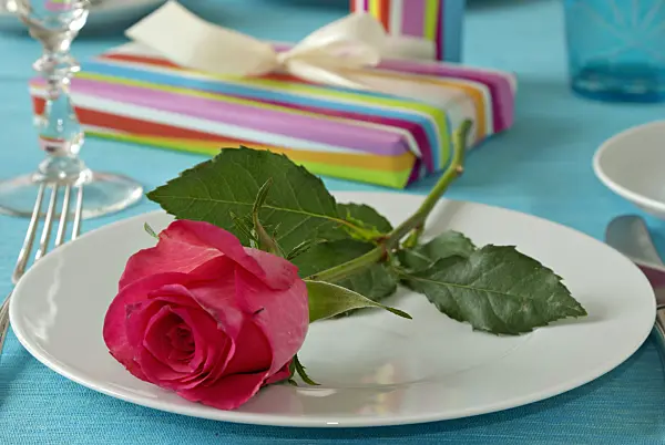 452165 - Table decoration with red rose and presents