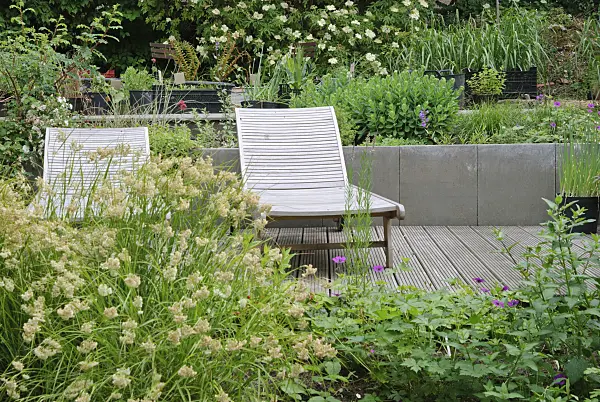 518036 - Two garden chairs on a decking area