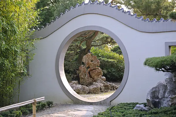 517111 - View of rock formation through a moon gate in a Chinese garden