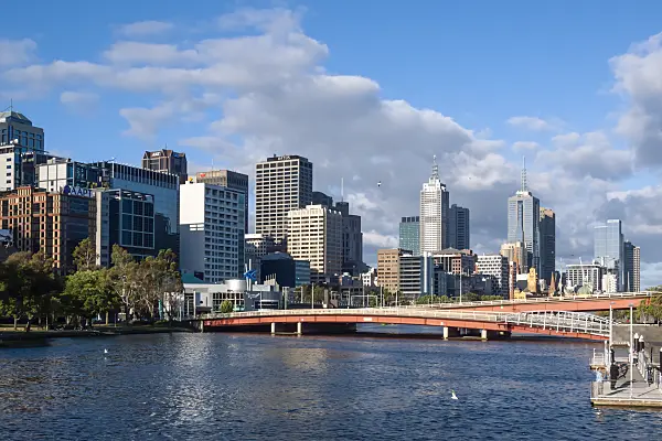 455226 - View over the Yarra River in sunny weather and cloudy skies to the skyline of Melbourne, Australia