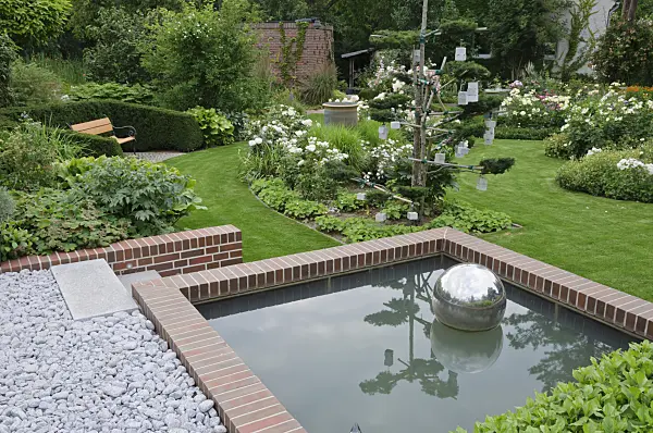 474063 - Water basin at the edge of a rose garden