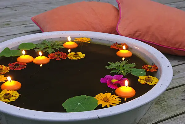 483032 - Water bowl with blossoms and floating candles