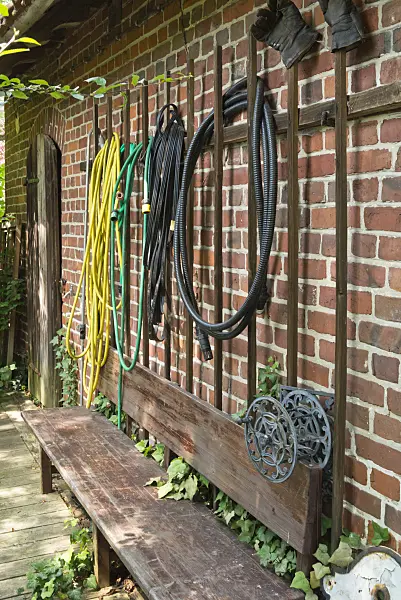 558289 - Water hoses on  a wall