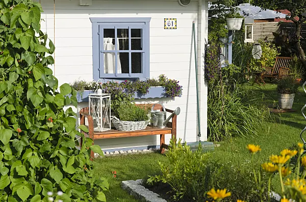 534284 - White garden house with bench