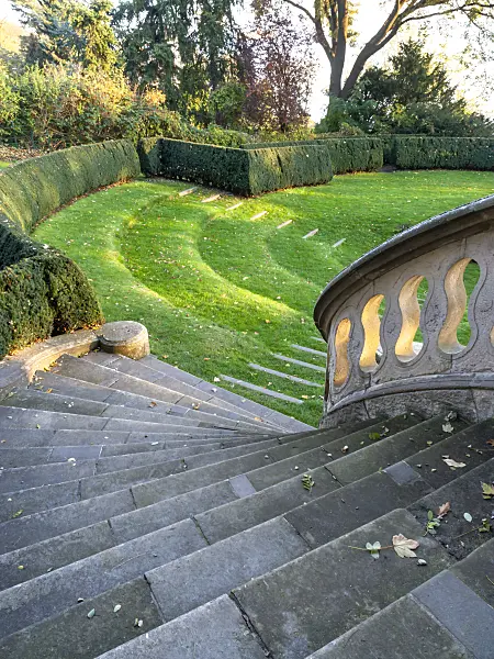 465297 - Wide winding stone staircase with stone railing and well-kept lawn, Römischer Garten, Hamburg, Germany