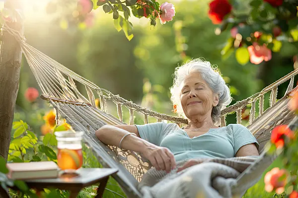 667053 - Woman lying in a hammock