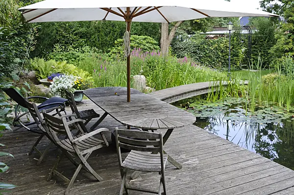 474042 - Wooden decking area with seats at a swimming pond