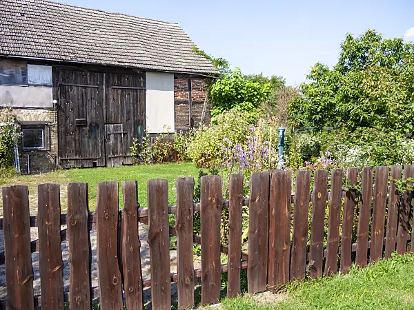 513097 - Wooden fence at a barn