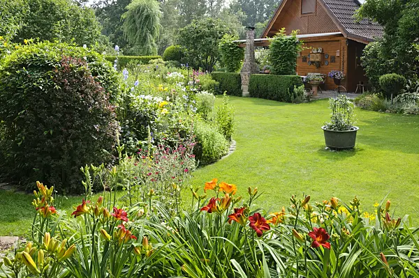 474106 - Wooden house with lawn and perennial beds