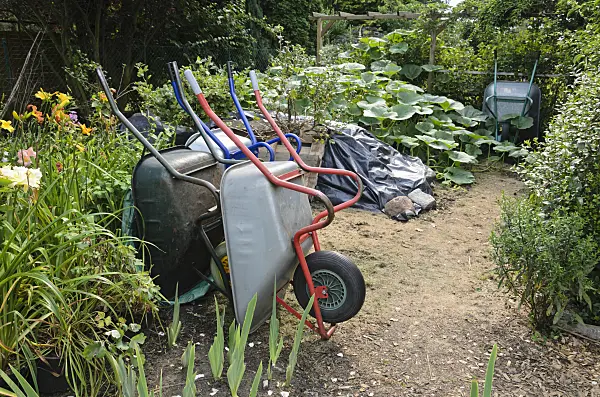 534514 - Workplace in  a garden with wheelbarrows